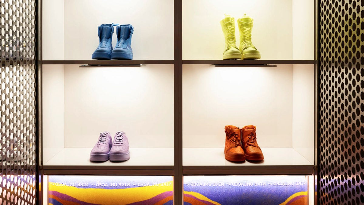 Colourful trainers on shelf in NIKE Unlaced interactive brand experience