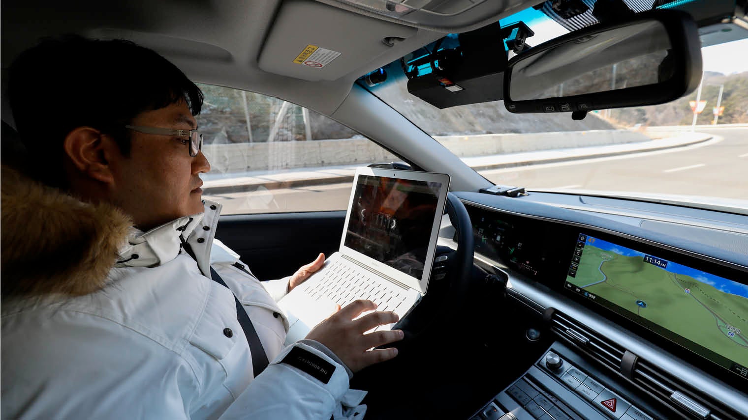 Hyundai engineer trialling a Nexo autonomous vehicle during a test drive in Pyeongchang, South Korea