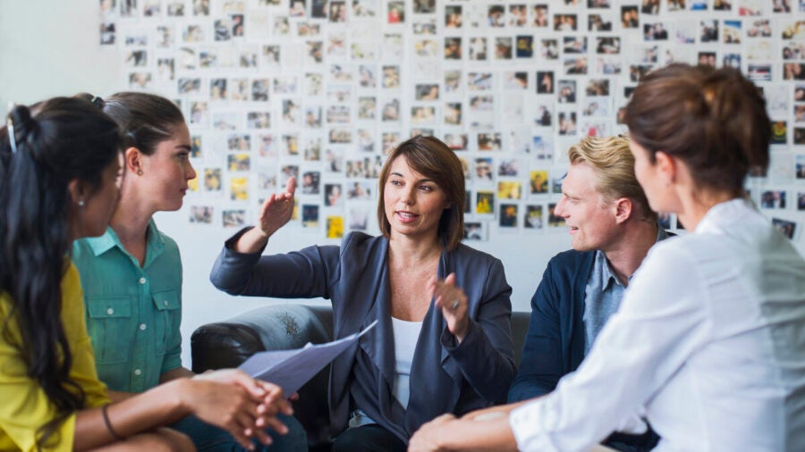 Businesswoman leading a meeting with her peers