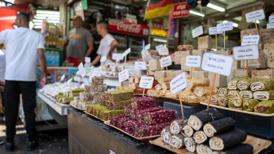 Shoppers At Carmel Market Shuk Ha Carmel In Tel Aviv Israel. Carmel Market Is A Very Popular Marketplace In Tel Aviv Sells Mostly Food And Home Accessories Goods 1