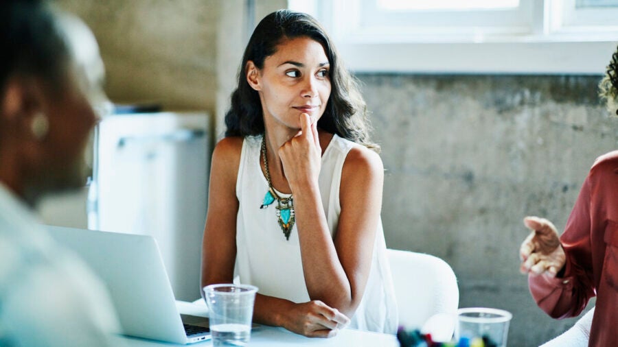 Young businesswoman in a meeting with colleagues