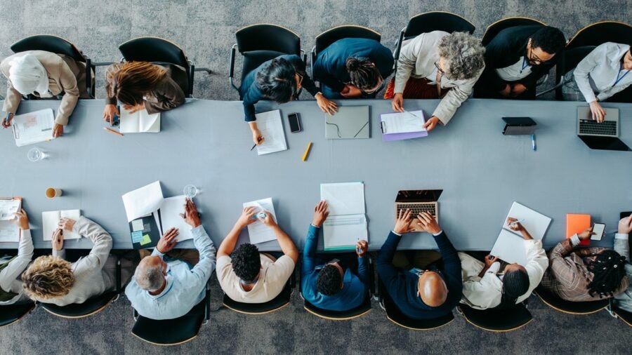 Bird's eye view of a group of workers in a meeting