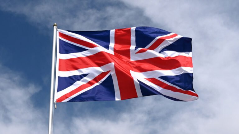 National Flag Of Great Britain Fluttering In Strong Wind