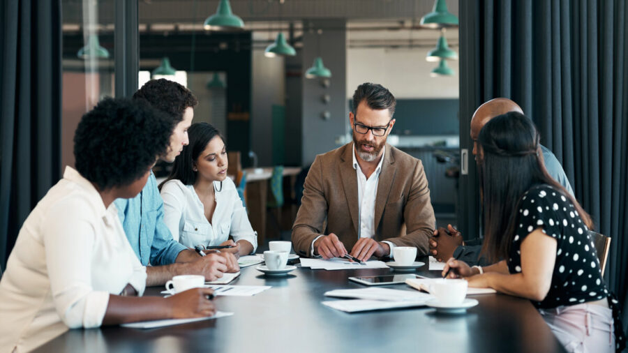 Planning, Project Management And Leadership With Business People In Meeting For Marketing Strategy, Review And Collaboration. Vision, Goals And Consulting With Ceo And Employee In Office For Research
